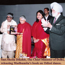 Smt.Sheila Dikshit, The Chief Minister of Delhi, releasing Madhumita's book on Odissi dance.